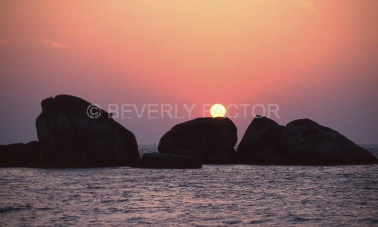 Island Sunsets;Thailand;rocks;sky;sillouettes;sunset;water;red;colorful;yellow;ocean